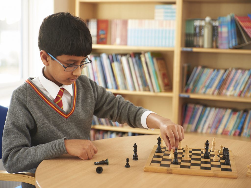 student playing chess