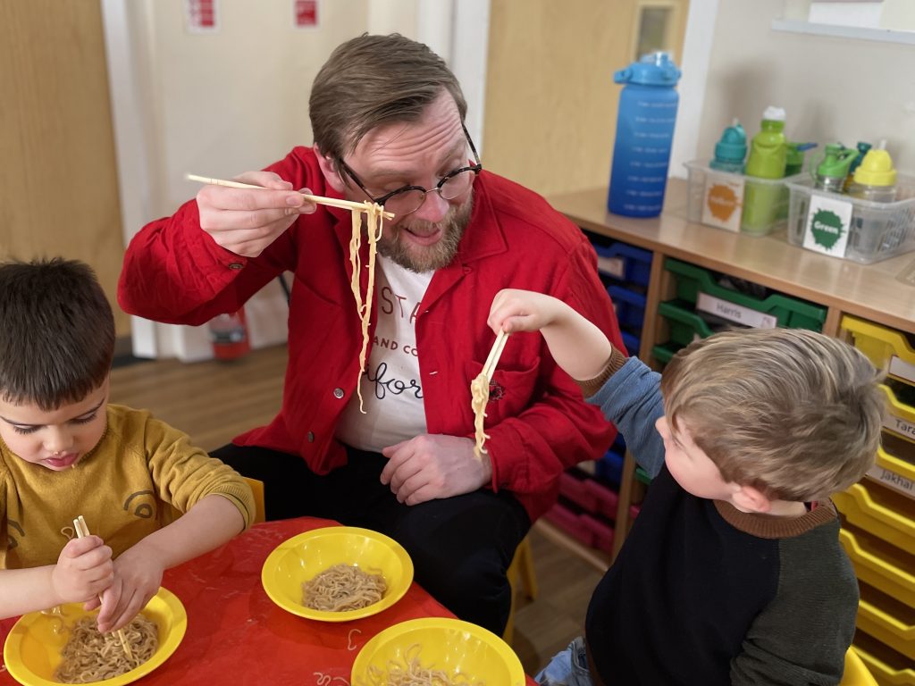 students eating noodles