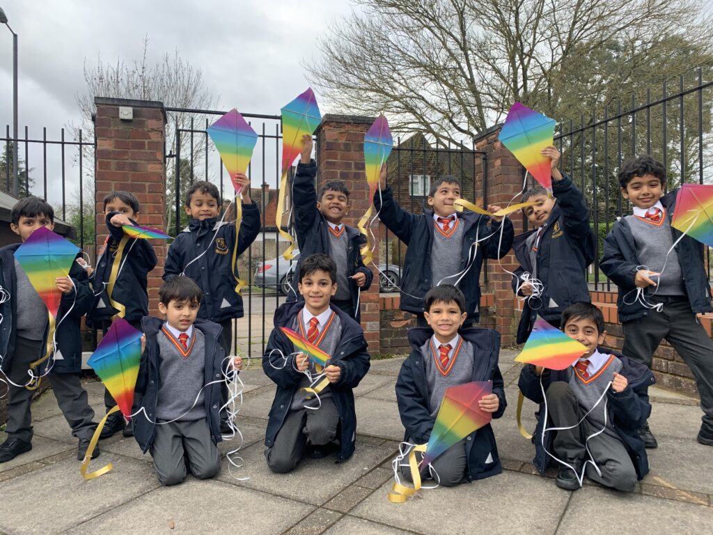 students holding kites