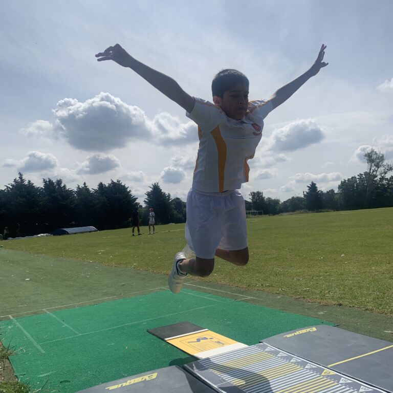 student jumping in the air